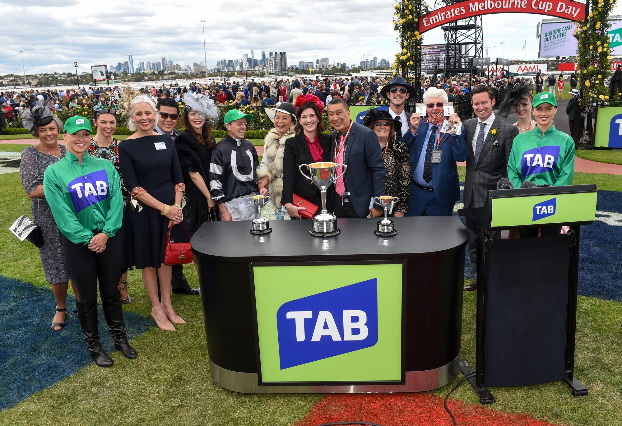 Barry Pang celebrates with his fellow owners.